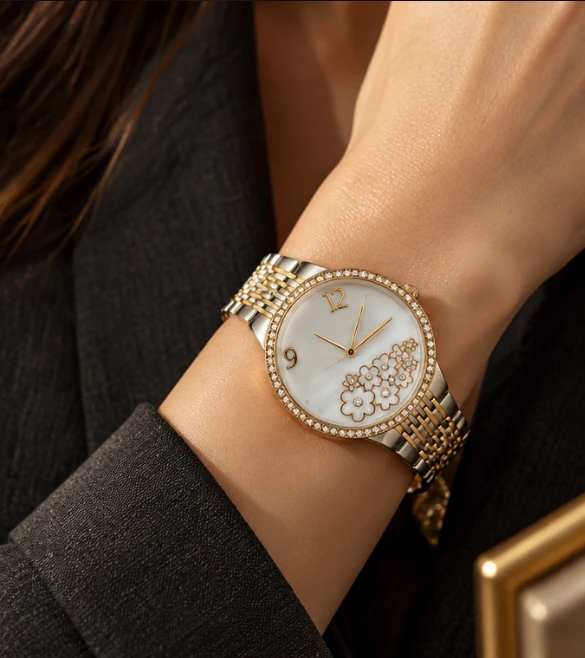 Two-tone watch with crystal bezel and floral mother-of-pearl dial