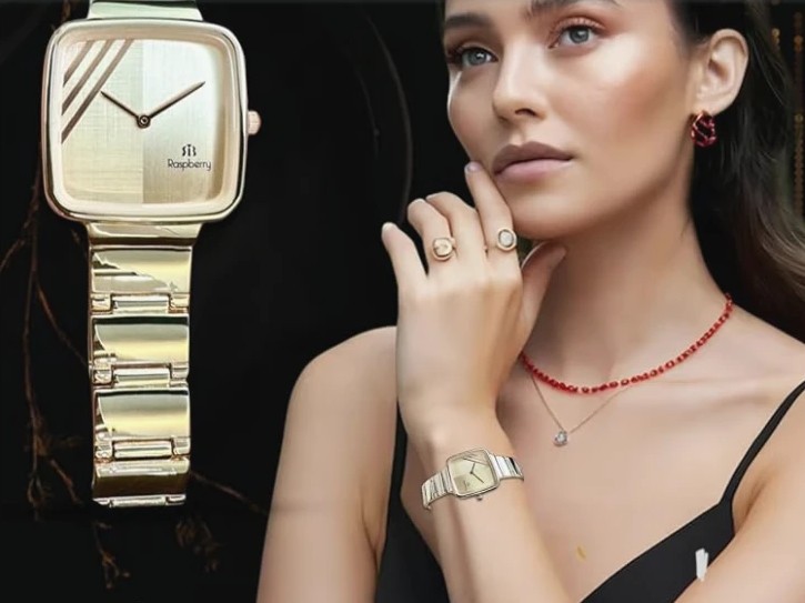 Woman wearing a Raspberry gold square watch